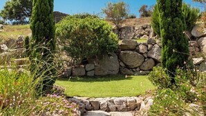 A stone pathway leading to a grassy area with two tall cypress trees. - Beautiful villa ' Les Figuiers' with pool between sea and mountain (Figari)