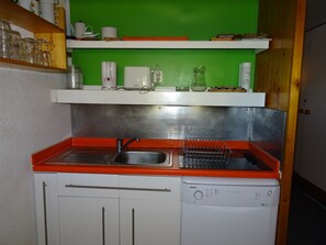 Enjoy cooking in this kitchen with a stainless steel sink, dishwasher, and ample storage.