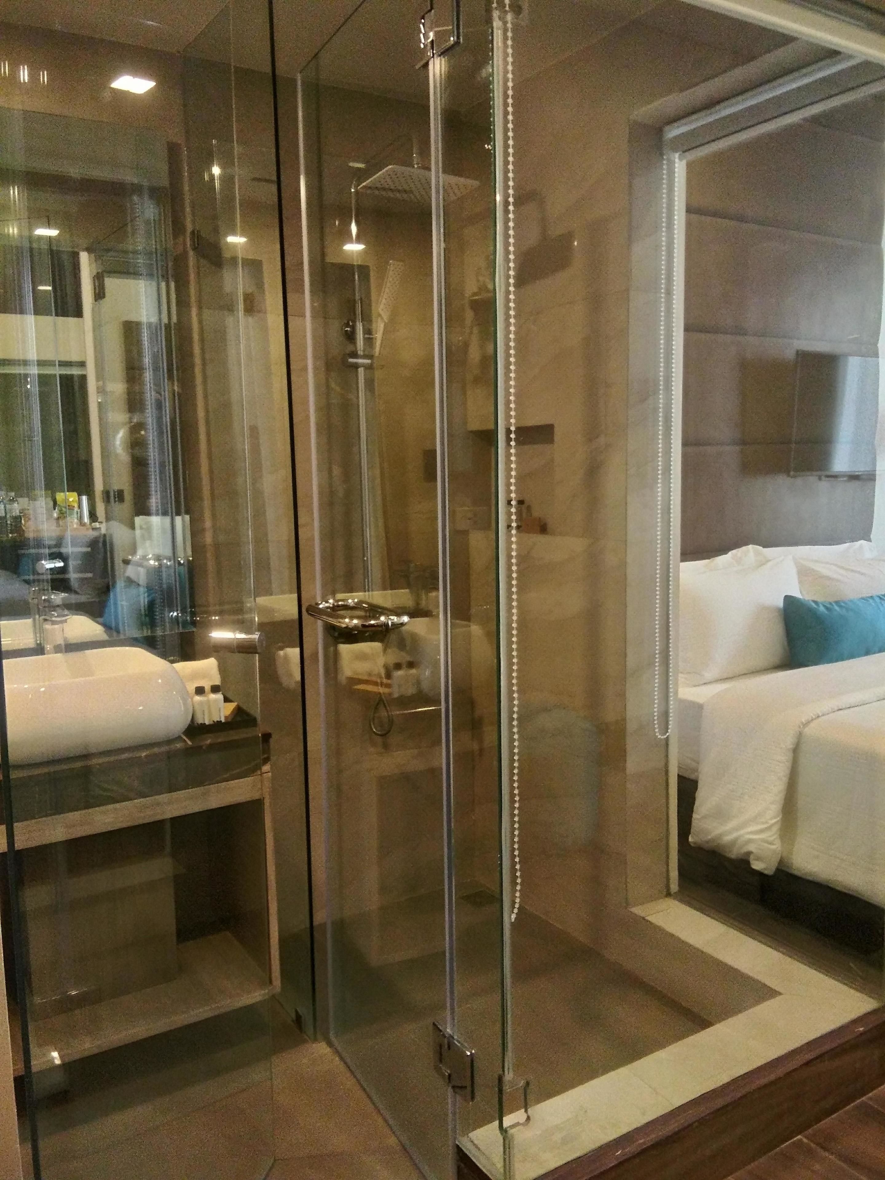 deluxe room | bathroom | shower, free toiletries, hair dryer, slippers