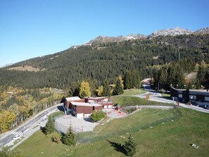 A building with a parking lot and a road.