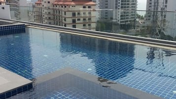 Outdoor pool, a rooftop pool, sun loungers