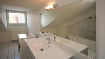 Bathtub, hair dryer, towels