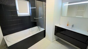 Bathtub, hair dryer, towels
