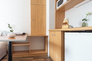 Studio, 2 Twin Beds | Private kitchen | Fridge, microwave, stovetop, cookware/dishes/utensils