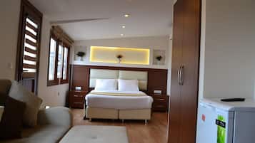 Deluxe Triple Room, Sea View | Minibar, in-room safe, desk, blackout drapes