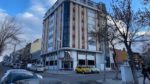 A multi-story hotel with a modern design, featuring a prominent entrance and a visible sign for 'BUYUK KALE'. - Buyuk Kale Hotel (Kars)