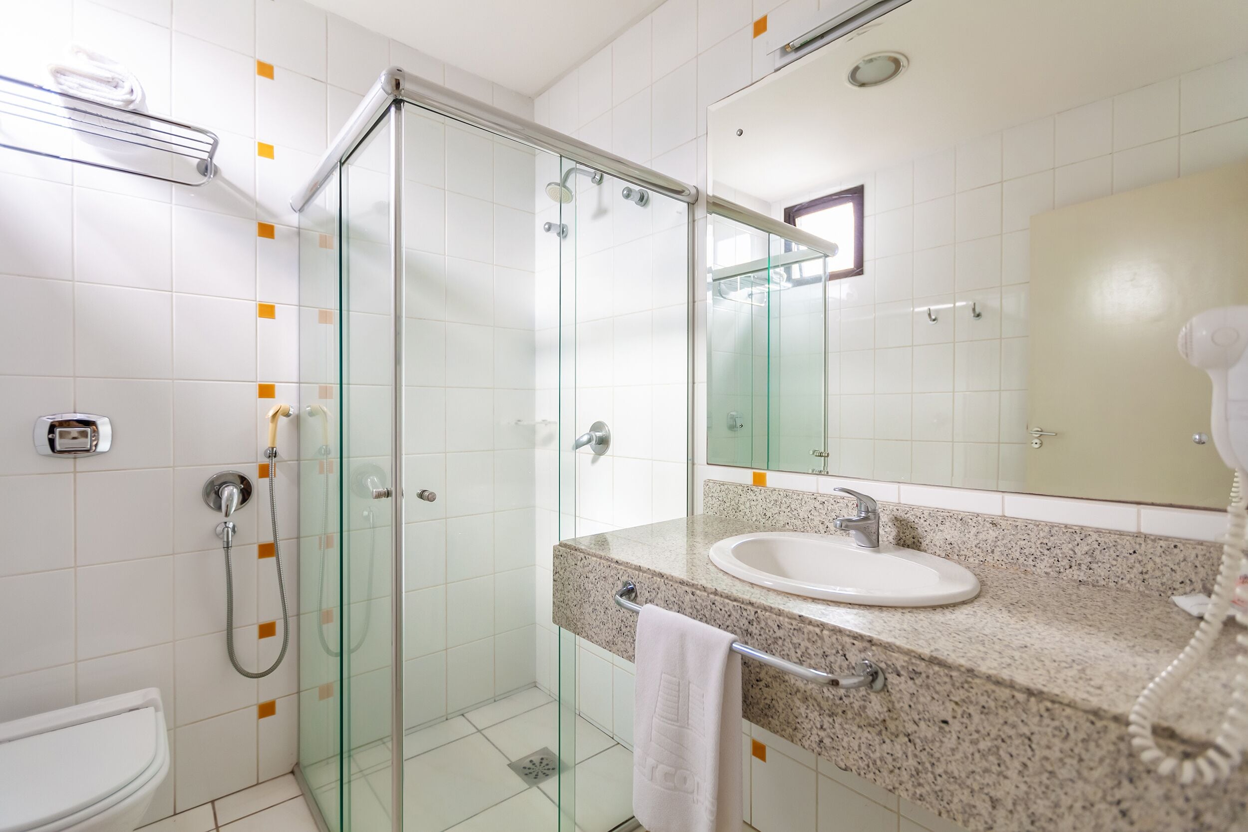 deluxe double room | bathroom | shower, rainfall showerhead, hair dryer, towels
