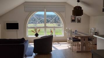 Apartment, 2 Twin Beds | Living area | Flat-screen TV, heated floors