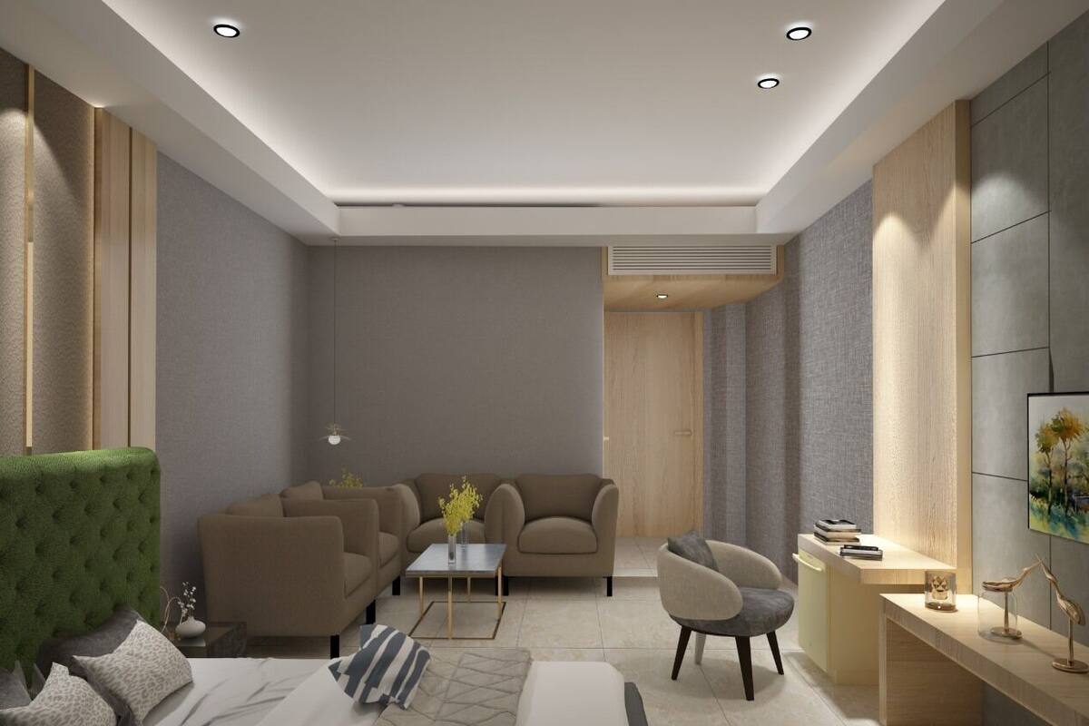 A modern living room with a sofa, armchairs, a coffee table, and a small side table with decorative items.