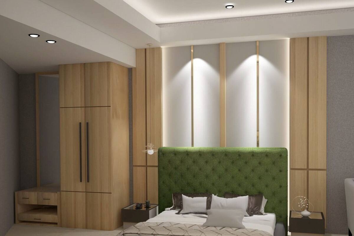 A modern bedroom with a large bed, wooden wardrobe, and built-in lighting.