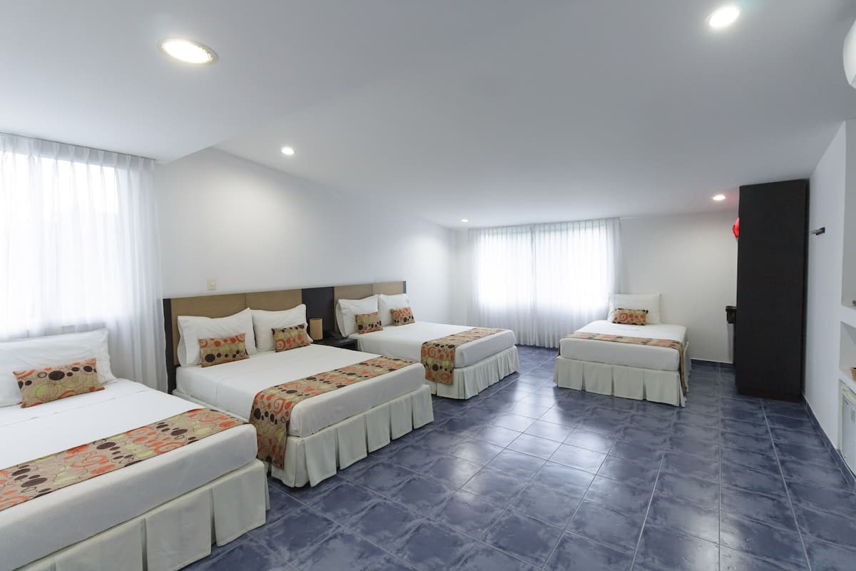 Quadruple Room | Minibar, in-room safe, desk, laptop workspace