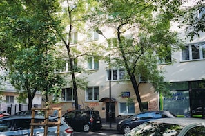 Stroll past ALNIA CHEMICA, a commercial building with a flat facade and large windows.
