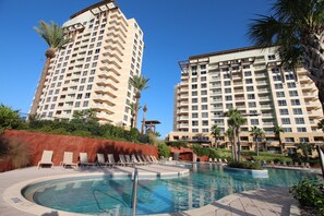 A hotel with a pool area, including lounge chairs and a water feature. - Remodeled. Luau 6705 in Sandestin.Tram, wifi, larger Studio with balcony (Miramar Beach)