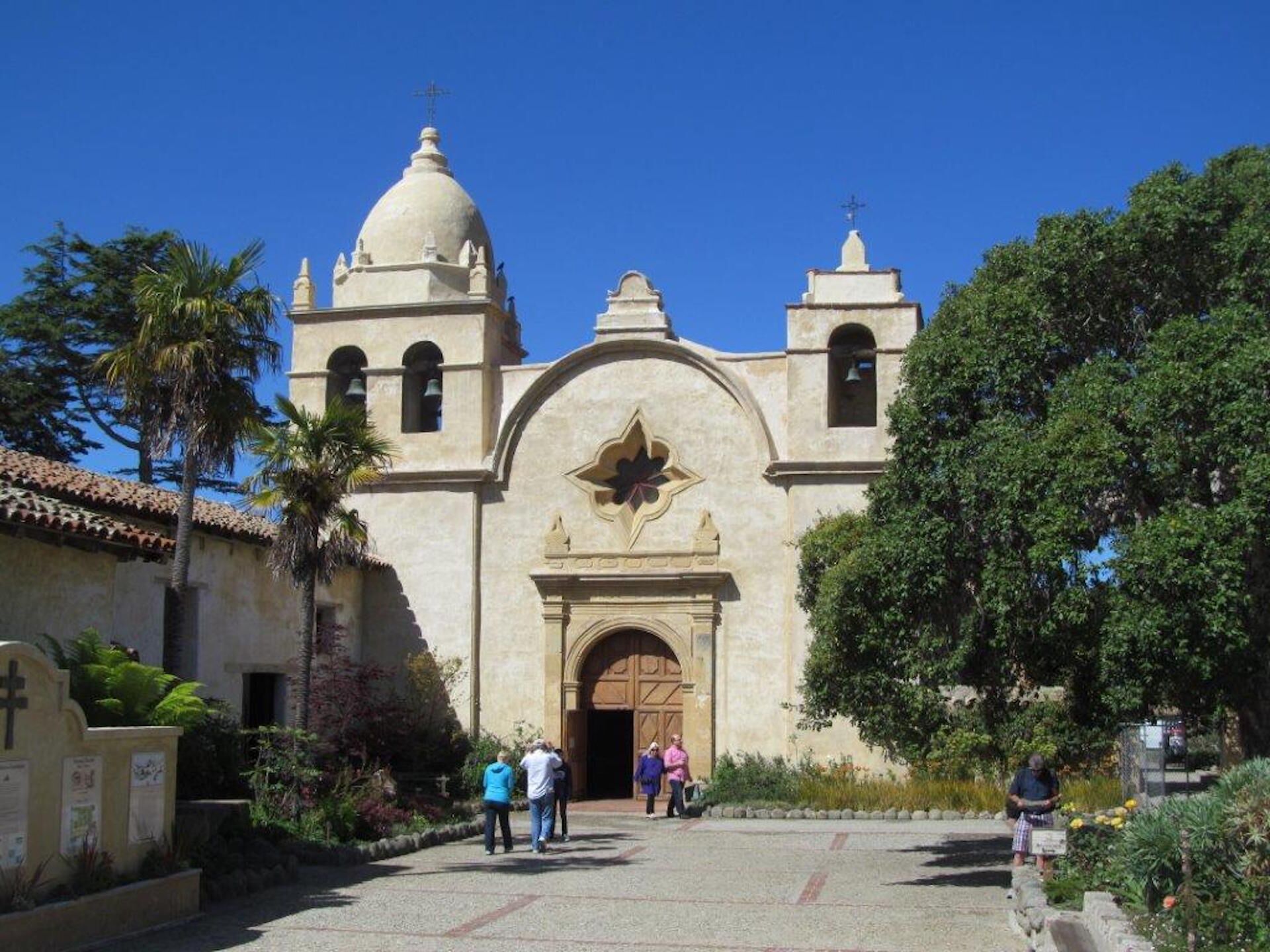 A historic church with a large dome and two bell towers.