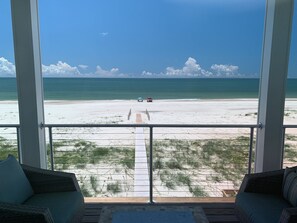 On the beach, sun loungers, beach towels - Gulf Front Beach House with open concept and elevator and 220 ft boardwalk. (Port St Joe)