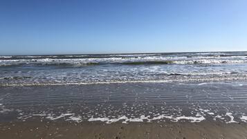 On the beach, sun loungers