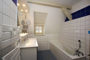 Bathtub, hair dryer, towels, soap