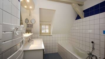 Bathtub, hair dryer, towels