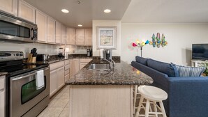 A modern kitchen with granite countertops, stainless steel appliances, and a central island. - 2-A DELANO CONDO - OCEAN BLOCK-1406 Coastal Hwy, Dewey Beach- DOG FRIENDLY! (Dewey Beach)