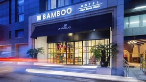 A hotel named "Bamboo" with a modern facade and large windows. - The Bamboo Hotel Hong Qiao Airport (Shanghai)