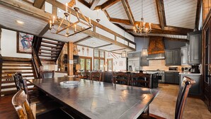 A spacious kitchen with high ceilings, wooden beams, and modern appliances. - Great for Big Groups, Mile from Lifts, High End Finishes, Huge Deck, Hot Tub (Keystone)