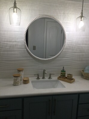 Shower, hair dryer, towels, toilet paper