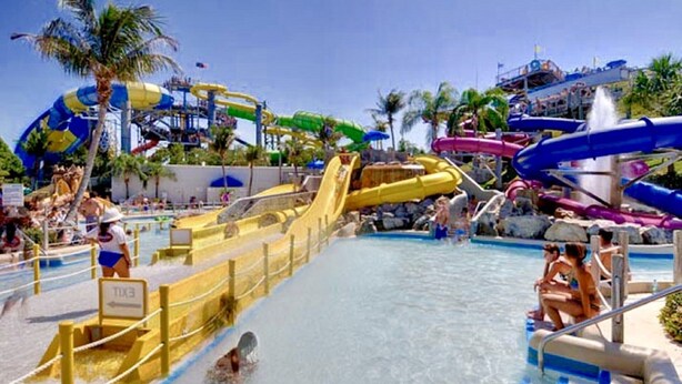 A water park with multiple water slides and a swimming pool. - Renovated Cozy Chic North Fork Cottage, steps away from the Beach & Wine Trail!! (Calverton)
