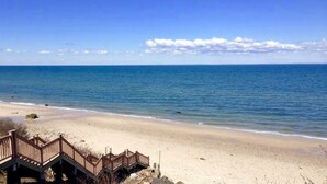 A beach with a wooden boardwalk leading to a sandy shore. - Renovated Cozy Chic North Fork Cottage, steps away from the Beach & Wine Trail!! (Calverton)