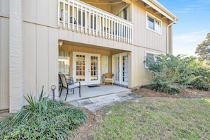 Enjoy outdoor dining or relaxation on the covered patio and take in the views from the upper floor balcony.