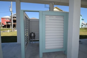 Enjoy an outdoor space with a metal gate and storage container.