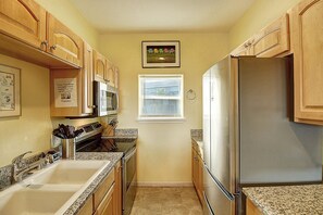 Fridge, microwave, oven, stovetop - Blues Away is a ground floor beachside retreat in the heart of Port Aransas. (Port Aransas)