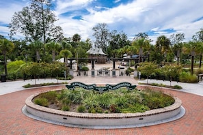 Explore Hilton Head Island's scenic outdoor space, featuring a winding brick pathway and lush landscaping.