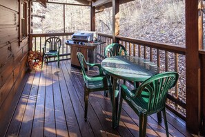 Enjoy al fresco dining on this deck with a barbecue grill and comfortable seating for four.