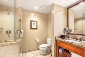 A modern bathroom with a glass-enclosed shower, a toilet, and a vanity with a mirror. - Honua Kai | Ocean View Studio | Studio Discount | Car Incl. w/ 6+ Nights | HKH-323 by KBM (Lahaina)