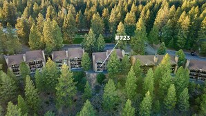 An aerial view of a residential area with numbered properties, surrounded by dense forest. - Modern 3-bedroom Seventh Mountain Resort Condo (Bend)