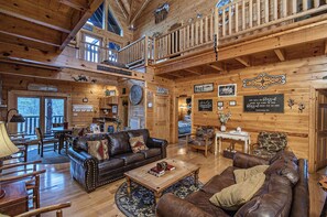 Télévision, cheminée, lecteur de DVD, baby-foot