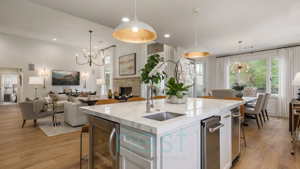 A modern kitchen with a central island, stainless steel appliances, and pendant lighting. - PRIVATE LUXURY HOME!!!  4mi to Downtown |4 Bedrm | 3 Bath | Sleeps 8 (Austin)