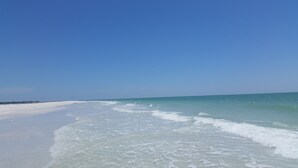 A beach with clear skies and calm waters.