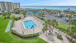 A resort with a swimming pool, tennis courts, and a view of the ocean. - 🌊 Islander #508 – Beachfront Bliss with Amazing Views! 🏖️✨ (Destin)