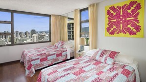 A hotel room with two beds, a city view, a large window, and a decorative wall piece. - 30% Off Now! Luxury One Bedroom - Free Parking! &  Free WiFi!! (Unknown)