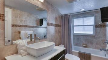 Bathtub, hair dryer, towels