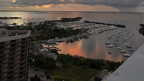 A marina with numerous boats docked, surrounded by buildings and greenery. - Luxury Penthouse w/Private Rooftop Terrace in Coconut Grove Hotel! (Miami)