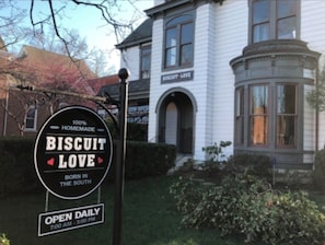 A sign for a bakery named Biscuit Love, indicating it is a homemade business.