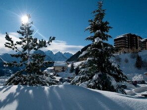 Perched on a mountain slope, this hotel offers breathtaking views of the surrounding snow-covered landscape.