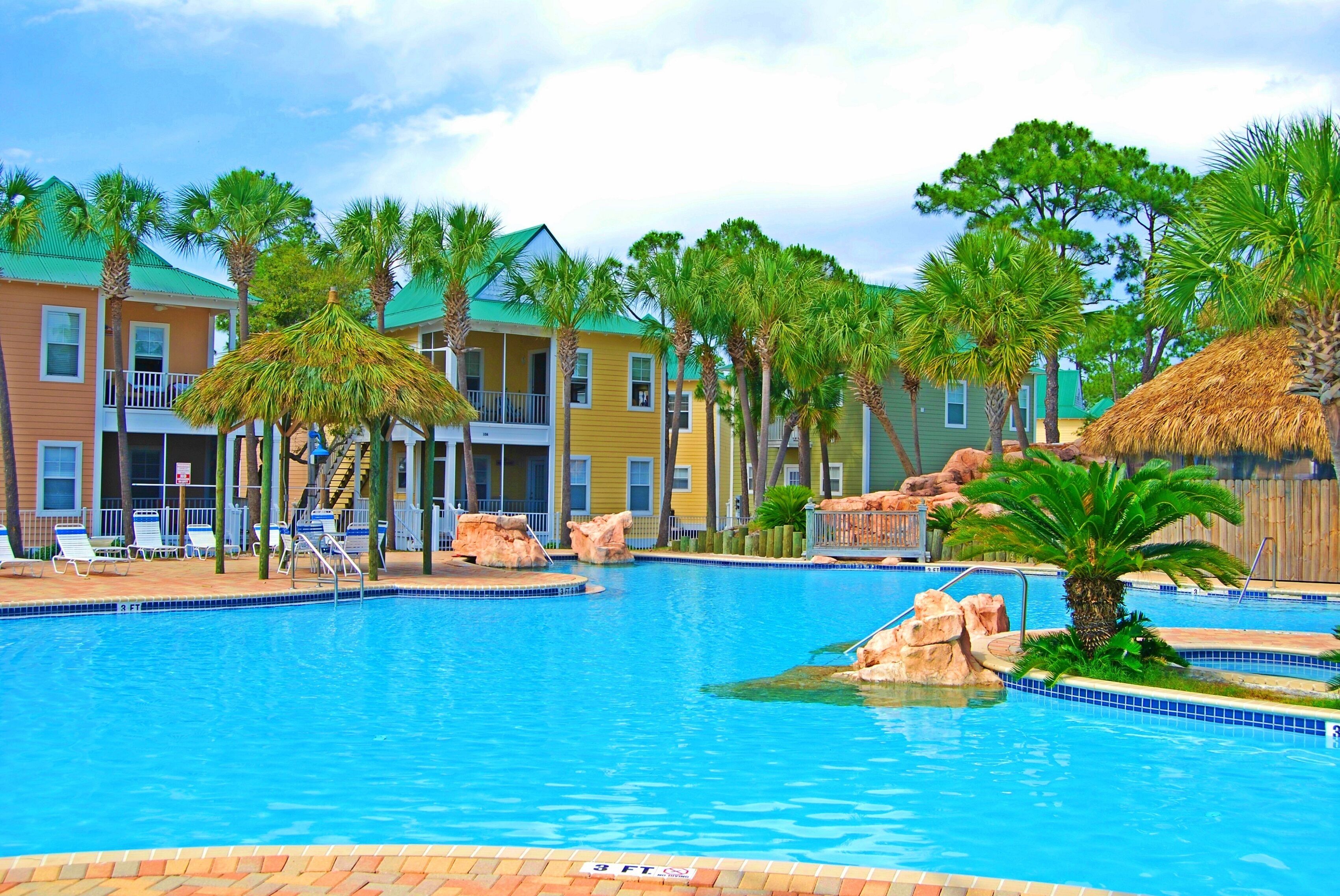 Tropical Haven: Resort Condo Retreat with Oasis Pool and Poolside Tiki Bar
