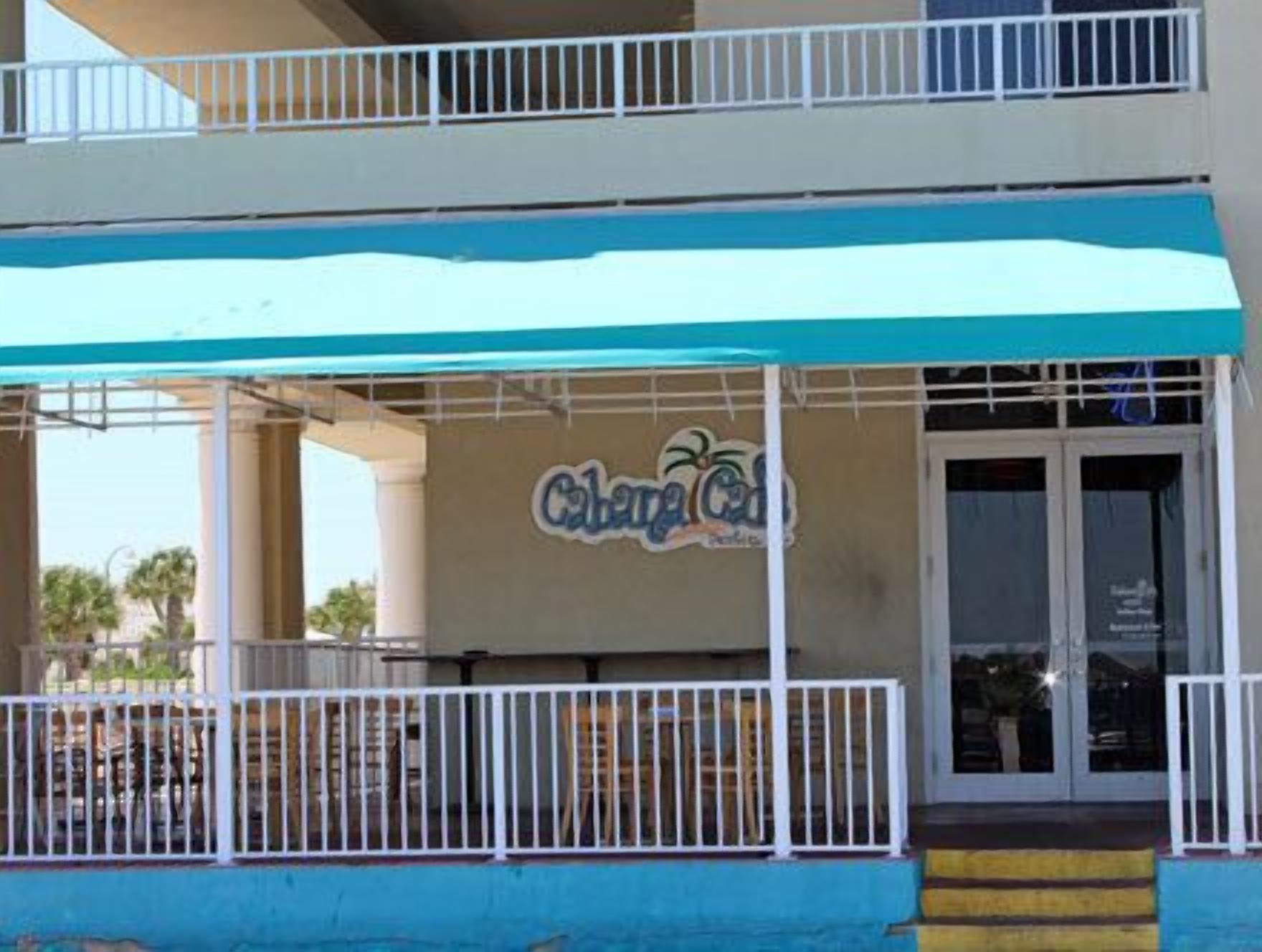 A two-story building with a sign reading "Chara's".