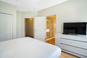 Indulge in relaxation at this cozy bedroom, complete with a personal TV – where every moment is a retreat into comfort and every show becomes a delightful escape.