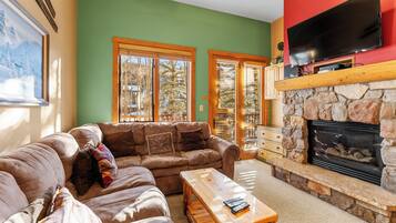 Flat-screen TV, fireplace, DVD player, video library