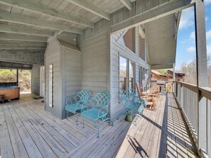Relax on the deck with a hot tub and comfortable seating.