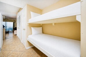 A bunk bed room with a view of the balcony. - Royal Palms 1BR 2BA! Condo 1207 ~ (Gulf Shores)